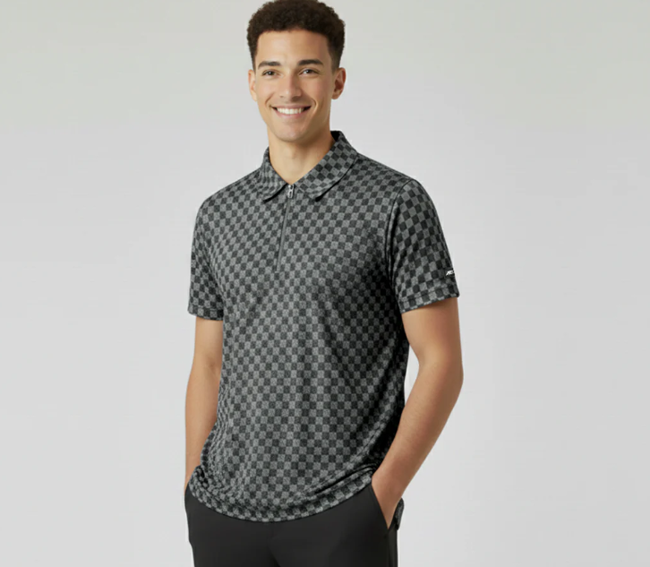 Man wearing a patterned polo shirt against a plain background